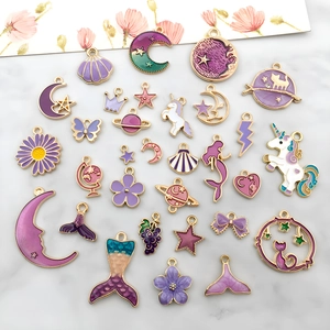 Purple and gold metal enamel charms in moon, star, and heart shapes for DIY jewelry