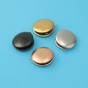 Detailed view of 316L stainless steel round locket pendants in four metallic finishes