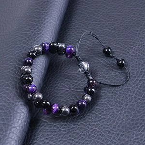 Double layer beaded bracelet with purple tiger eye and obsidian on black leather background