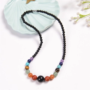 Macro detail of Bohemian colorful natural agate beads and chakra stones necklace