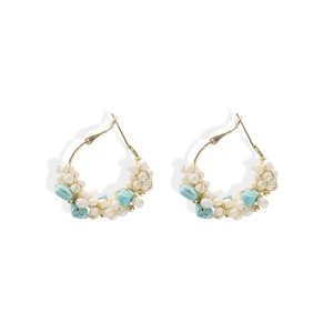 Bohemian gold hoop earrings with natural pearls and turquoise stones on white background