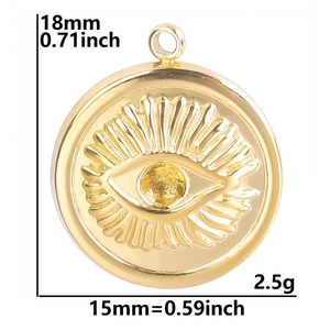 Detailed view of golden Evil Eye pendant with size markers showing 15mm diameter