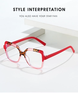 Detail view of stylish square red glasses frames with leopard print upper accent
