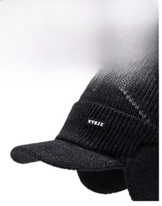 Close-up of the reinforced peak on a warm knitted winter hat with ear protection