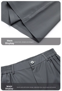 Detail of dark gray pants showing elastic waistband with button and textured fabric finish