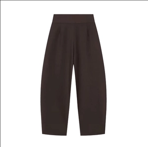 Detailed view of high waisted pleated balloon pants in deep coffee brown color
