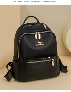 Detail view of black leather backpack featuring gold kangaroo logo and zipper compartments