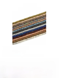 Macro detail of 5x8mm natural geode agate beads showing texture and vibrant earth tones