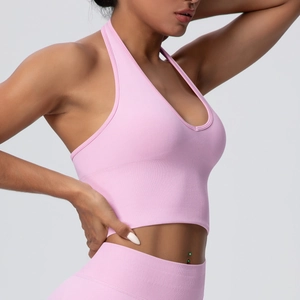 Breathable halter yoga bra in pale pink featuring seamless high-elasticity fabric