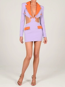 Detail of color-block blazer dress featuring purple and orange cut-out design