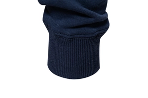 Detailed view of dark blue ribbed cuffs on a high-quality knit sweatshirt sleeve