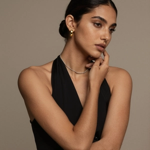 Elegant gold chunky C-shaped hoop earrings and delicate silver necklace set for women
