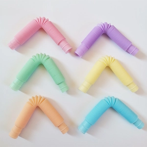 Set of six colorful plastic stretch tubes in pink, purple, green, yellow, orange and blue