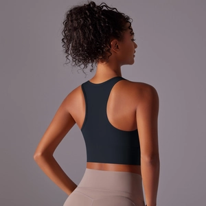 Detail of black racerback sports bra showing seamless compression fabric and back support