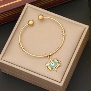 Gold plated stainless steel evil eye open cuff bracelet with turquoise enamel inlay