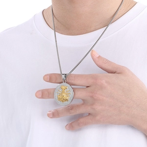 Close-up of a silver chain and gold-silver Viking Thor's hammer pendant on a model