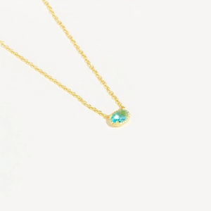 Minimalist S925 silver necklace featuring an oval light blue stone pendant in gold finish