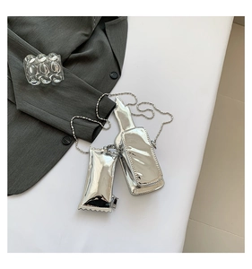 Creative silver chocolate-shaped mini bag with metal chain strap on white background