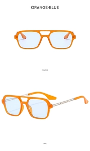 Detail view of orange aviator sunglasses with blue lenses and metal temple accents