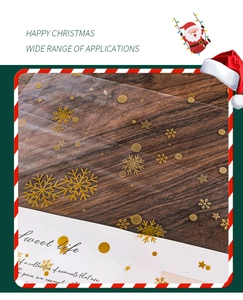 Detail of transparent Christmas wrapping paper with golden snowflake and star patterns