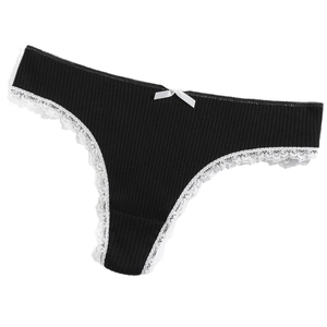 Black ribbed cotton thong with white lace trim and bow accent shown in flat lay view
