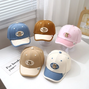 Five assorted cotton baby baseball caps with bear embroidery and curved sun visors