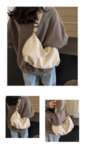 Detailed views of creamy white PU leather tote bag with soft folds and wide shoulder strap