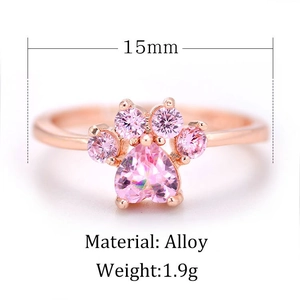 Detail view of adjustable cat paw ring with pink zircon and 15mm width measurement