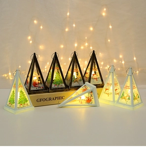 Close-up of LED Christmas triangular lanterns with Santa and reindeer festive illustrations