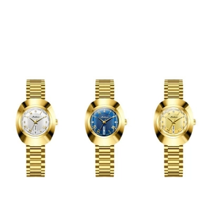 Detailed view of oval gold-tone watches featuring date-day display and metallic link straps