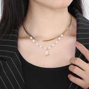 Double-layered gold titanium necklace featuring a butterfly pendant and white pearls