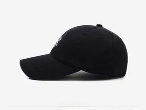 Side view of a vintage black washed cotton baseball cap with white embroidery logo