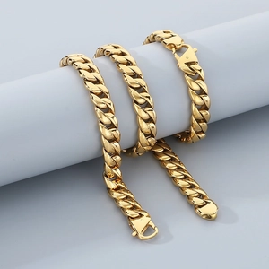 Polished 12mm golden Cuban link chain bracelet for men wrapped on a white cylinder stand