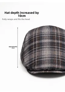 Detail showing 10cm deep fit and textured plaid fabric of the vintage newsboy cap