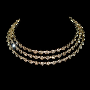 Luxury three-row crystal necklace set with brilliant round diamonds in gold setting