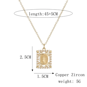 Macro detail of copper zircon Virgin Mary pendant with size markings and 45cm chain