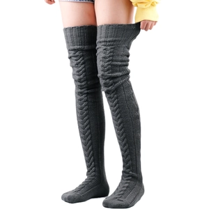 Close-up of dark grey cable knit over-knee socks with thick wool texture and high elasticity