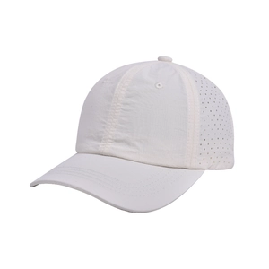 Close-up of white breathable baseball cap showing laser-cut side ventilation holes