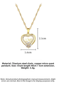 Detailansicht goldener Herzanhänger mit LOVE-Gravur und weißem Zirkon an Stahlkette