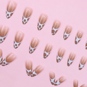 Almond-shaped gradient nude brown fake nails with white geometric dot pattern design