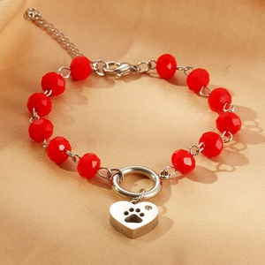 Red faceted bead bracelet with hollow heart paw pendant and sparkling crystal accent