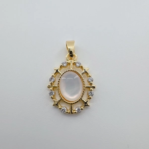 Detail of 18K gold-plated oval shell pendant with zircon star accents and hook