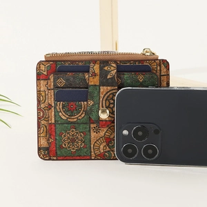 Macro detail of slim cork wallet featuring colorful mandala patterns and multi-card slots