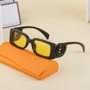 Chic rectangle black sunglasses with yellow lenses and luxury interlock logo