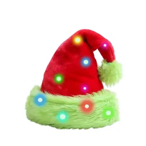 Detail of red plush Christmas hat with green faux fur trim and integrated colorful LED lights