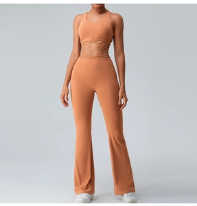 Detail of racerback yoga crop top with crossover waist ties and flared leggings set