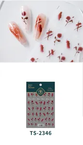 Detail of 5D smudge rose nail stickers with delicate red floral patterns and packaging