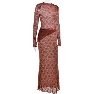 Detail view of lace texture on red-brown long sleeve dress with intricate patterns