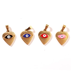 Golden heart pendants with colorful evil eye enamel in black, blue, red, and pink