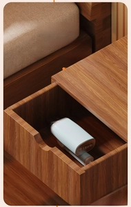 Folded handheld portable steam iron stored in a compact wooden drawer for travel